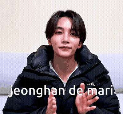 A Young Man In A Black Jacket With The Words Jeonghan De Mari GIF