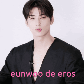 A Young Man In A Black Shirt With The Words Eunwoo De Eros Written On The Bottom GIF