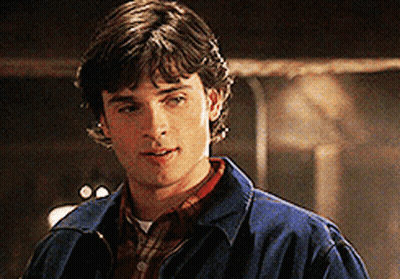 A Young Man In A Blue Jacket And Plaid Shirt GIF