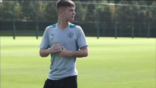 A Young Man In A Blue Shirt With The Number 11 On It GIF
