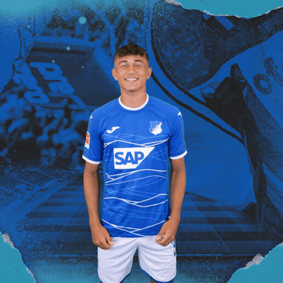 A Young Man In A Blue Shirt With The Word Sap On It GIF