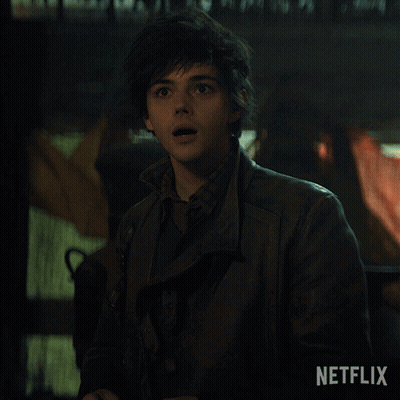 A Young Man In A Leather Jacket Says Hi In A Netflix Ad GIF