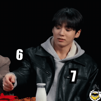 A Young Man In A Leather Jacket With The Number 7 On His Sleeve GIF