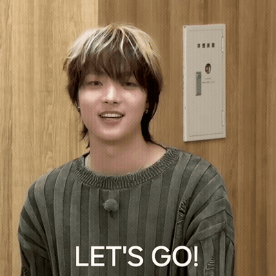 A Young Man In A Striped Sweater Says " Let 'S Go " GIF