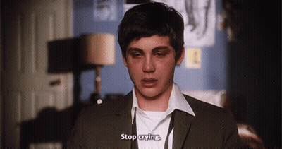 A Young Man In A Suit And White Shirt Is Crying And Says Stop Crying . GIF
