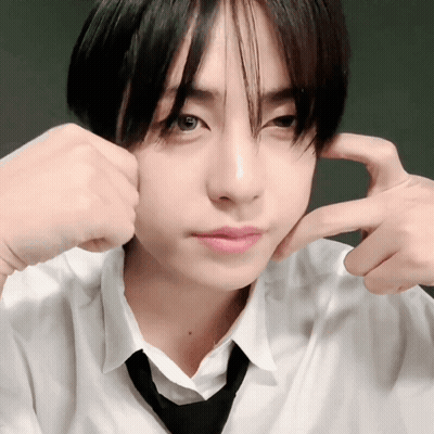 A Young Man In A White Shirt And Black Tie Is Making A Face GIF