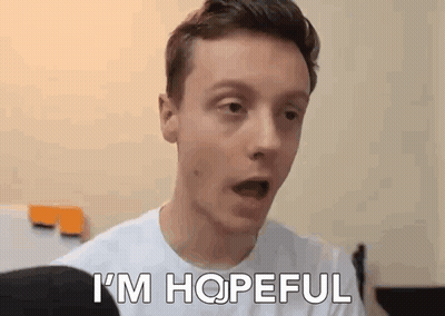 A Young Man In A White Shirt Is Making A Surprised Face And Saying `` I 'M Hopeful '' . GIF