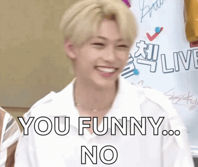 A Young Man In A White Shirt Is Smiling And Says You Funny No GIF