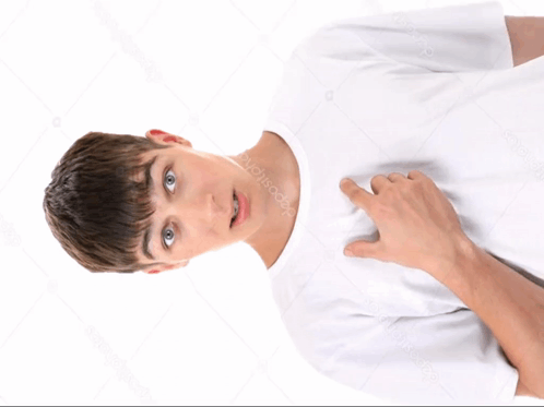 A Young Man In A White T-Shirt Is Pointing To His Chest GIF