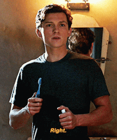 A Young Man Is Brushing His Teeth In Front Of A Mirror With The Words Right Written On His Shirt GIF