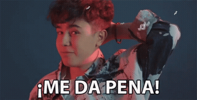 A Young Man Is Covering His Ear With His Hand And Says Me Da Pena ! GIF