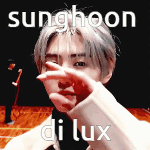 A Young Man Is Covering His Face With His Hand And The Words Sunghoon Di Lux Are Above Him . GIF