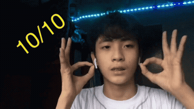 A Young Man Is Giving The Ok Sign With The Number 10 / 10 Behind Him GIF