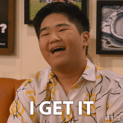 A Young Man Is Laughing With The Words I Get It Below Him GIF