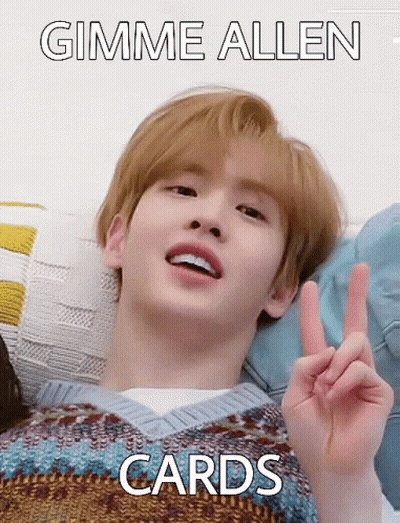A Young Man Is Laying On A Bed And Making A Peace Sign With His Hand . GIF