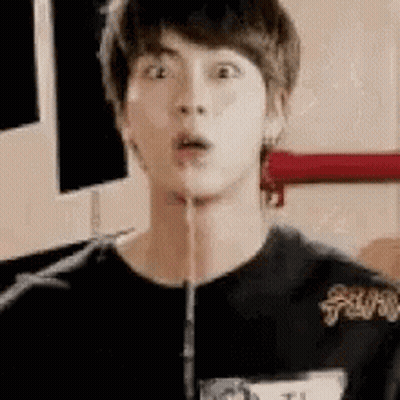A Young Man Is Making A Funny Face While Holding A Hose In His Mouth . GIF