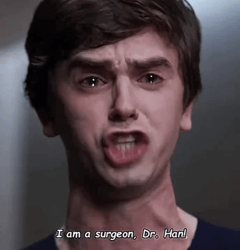 A Young Man Is Making A Funny Face While Talking To A Doctor . GIF