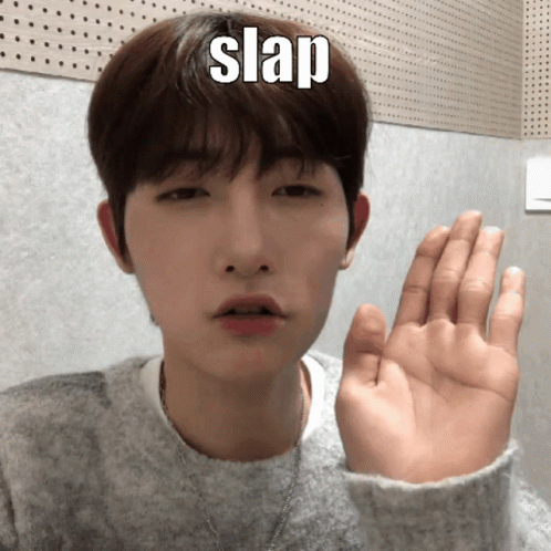 A Young Man Is Making A Funny Face With His Hand And The Word Slap Is On His Forehead GIF