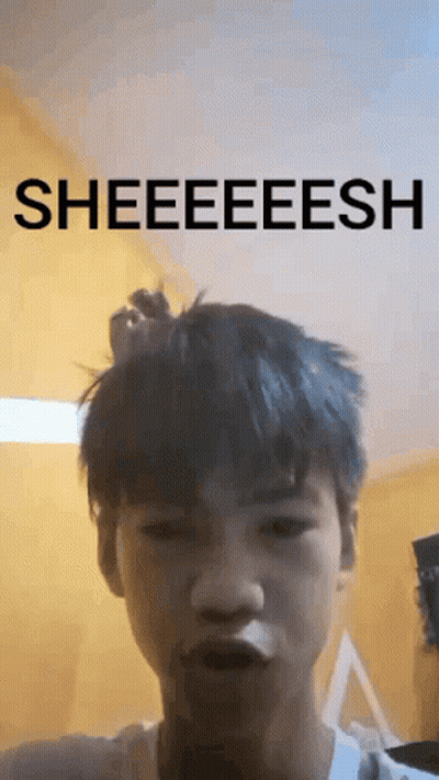 A Young Man Is Making A Funny Face With The Words Sheeeeesh Above Him GIF