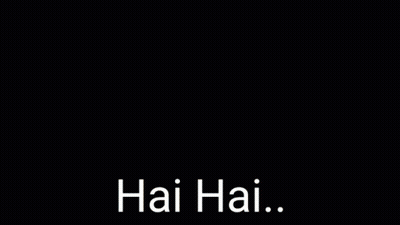 A Young Man Is Singing Into A Microphone With His Eyes Closed And The Words Hai Hai . GIF