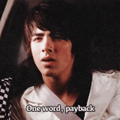 A Young Man Is Sitting In A Car And Says " One Word Payback " GIF