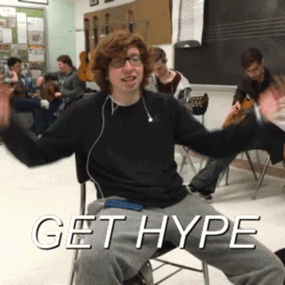 A Young Man Is Sitting In A Chair With The Words Get Hype Written Above Him GIF