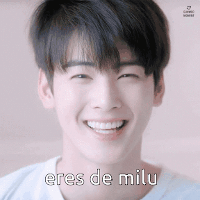 A Young Man Is Smiling With The Words Eres De Milu On His Face GIF