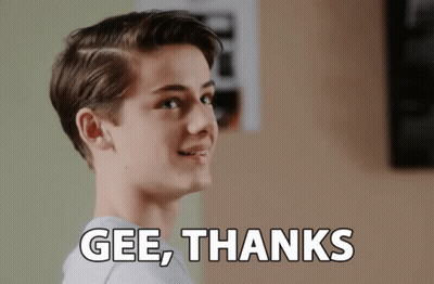 A Young Man Is Smiling With The Words Gee Thanks Above Him GIF