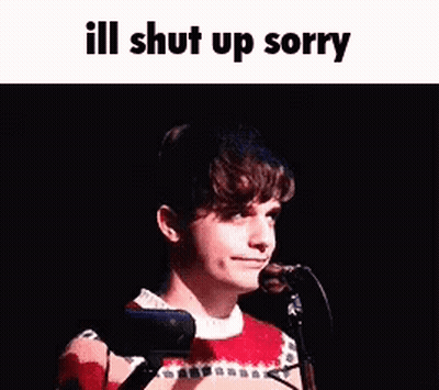 A Young Man Is Standing In Front Of A Microphone With The Words `` Ill Shut Up Sorry '' Written Above Him . GIF