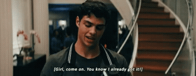 A Young Man Is Standing In Front Of A Staircase And Talking To A Girl . GIF