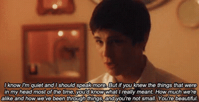 A Young Man Is Talking To Another Young Man In A Room With A Quote . GIF
