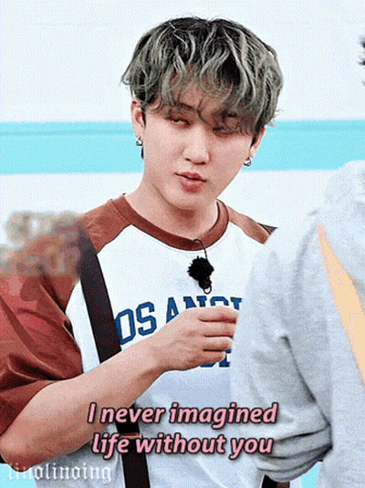 A Young Man Is Wearing A Los Angeles Shirt And Talking To Another Person . GIF