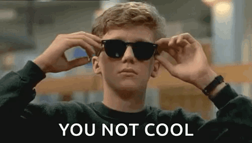A Young Man Is Wearing Sunglasses And The Words `` You Not Cool '' Are Written On The Bottom . GIF