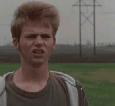 A Young Man Making A Funny Face In A Field GIF