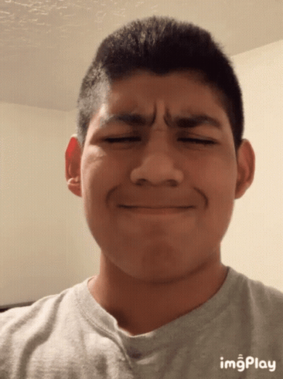 A Young Man Making A Funny Face With Imgplay Displayed On The Bottom Right GIF