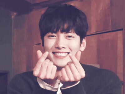 A Young Man Making A Heart With His Hands GIF