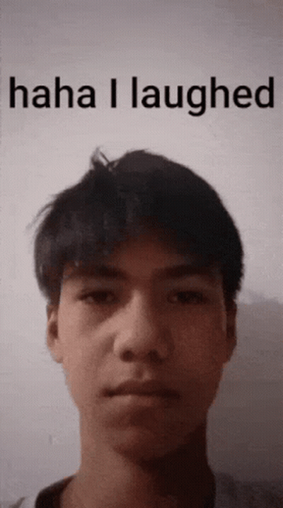 A Young Man 'S Face Is Shown With The Words Haha I Laughed Above It GIF