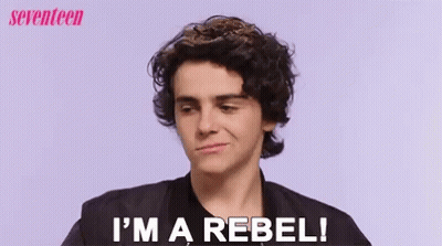 A Young Man Says I 'M A Rebel In Front Of A Purple Background GIF