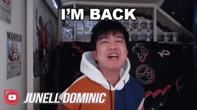 A Young Man Says I 'M Back While Standing In Front Of A Wanted Poster GIF