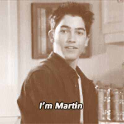 A Young Man Says I 'M Martin While Standing In A Kitchen GIF