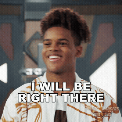 A Young Man Says I Will Be Right There While Smiling GIF