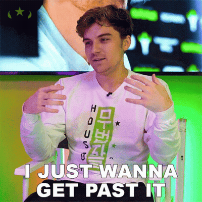 A Young Man Sitting In A Chair With The Words I Just Wanna Get Past It GIF