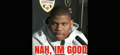 A Young Man Talking Into A Microphone With The Words " Nah Im Good " In Red Letters GIF