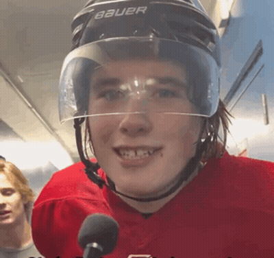 A Young Man Wearing A Bauer Helmet Is Smiling GIF