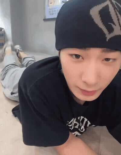 A Young Man Wearing A Beanie And A T-Shirt That Says ' A ' On It GIF