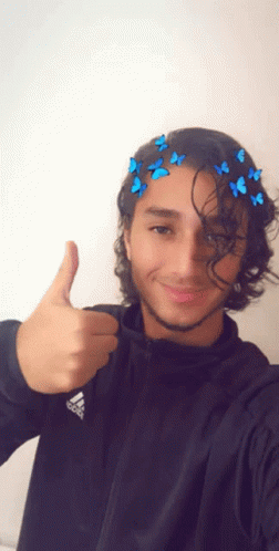 A Young Man Wearing A Black Adidas Jacket Giving A Thumbs Up GIF