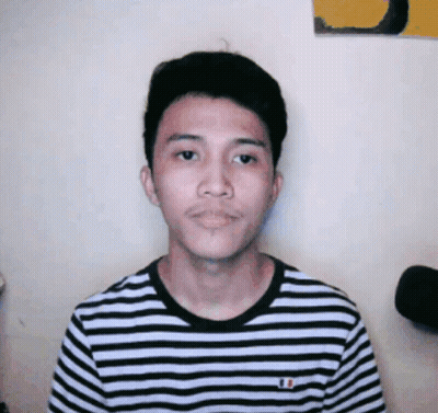 A Young Man Wearing A Black And White Striped Shirt With A French Flag On It GIF
