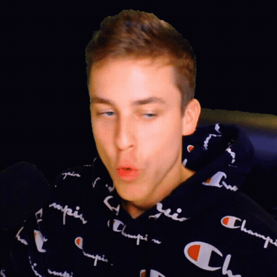 A Young Man Wearing A Black Champion Hoodie GIF