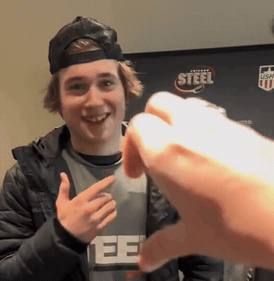 A Young Man Wearing A Black Hat And A Gray Shirt With The Word Steel On It GIF