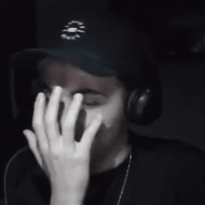 A Young Man Wearing A Black Hat With A Clock On It GIF